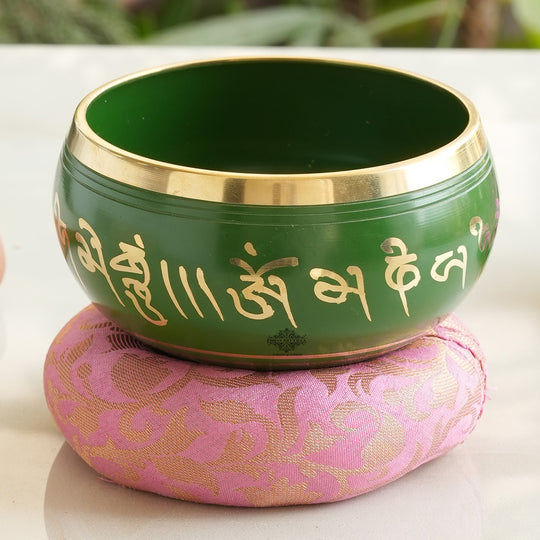 Indian Art Villa handcrafted green brass singing bowl with mantra design and cushion, ideal for meditation, healing.