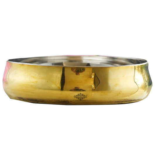 Handmade curved steel brass rice plate from Indian Art Villa with radiant brass finish and seamless polished interior