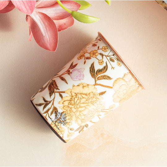 Bright gold prints enhance the pure copper glass created by Indian Art Villa for sophisticated daily use