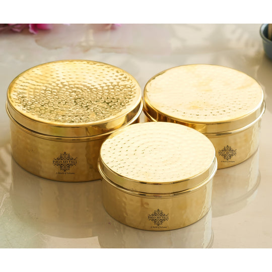 Premium brass container set in round shape with hammered top detail polished body and traditional artisan finish