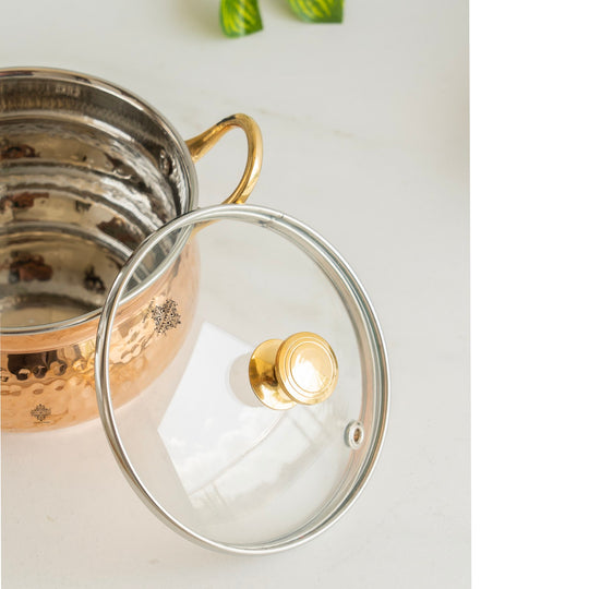 Embody tradition Indian Art Villa copper handi 950ML hammered brilliance topped by glass lid and intricate brass details