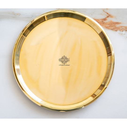 Indian Art Villa brass thali featuring plain polished finish broad circular base deep center and elevated smooth rim