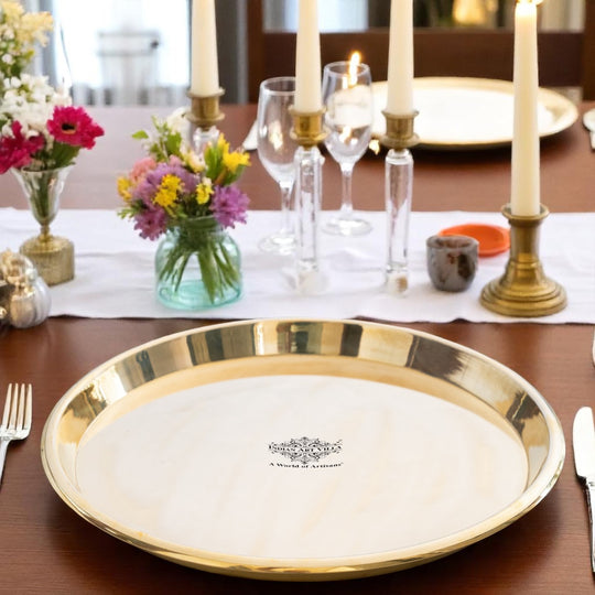 Shiny pital thali with polished surface and surrounding edge perfect for pooja and dining by Indian Art Villa