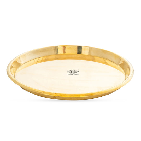 Pure brass plate with mirror finish and raised edges offering a clean circular profile and fine detailed construction