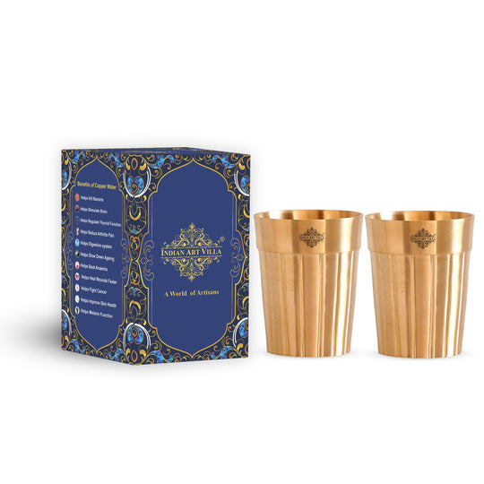 Set of two handcrafted pure brass glasses with a sleek lining design perfect for daily use or special occasions.