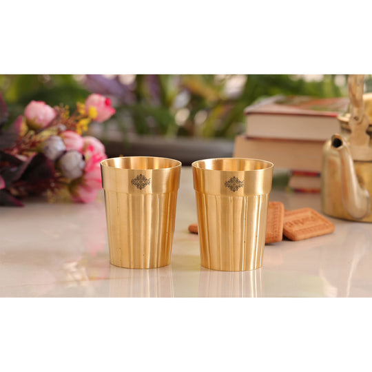 Handmade brass glass with elegant lined detailing perfect for enhancing any dining or serving occasion.