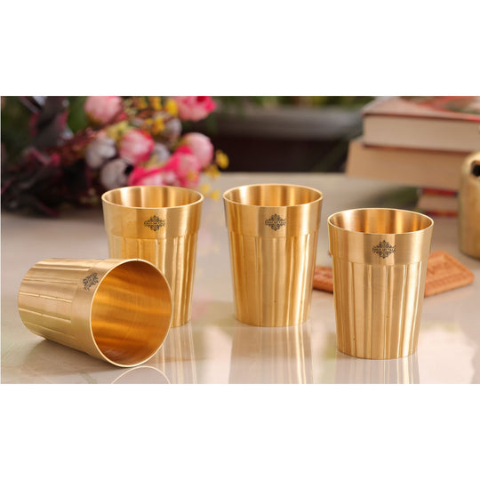 Traditional pure brass tumblers with a simple yet elegant lined design perfect for gifting or personal use.