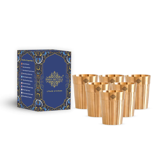 Refined brass glass with an elegant lined texture designed to offer a luxurious drinking experience for any occasion.