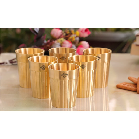 Pure brass tumbler with polished lining design offering a traditional touch with a contemporary look