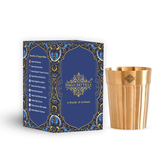 Crafted brass glass with a unique lined design, offering a timeless aesthetic and ideal for serving drinks.