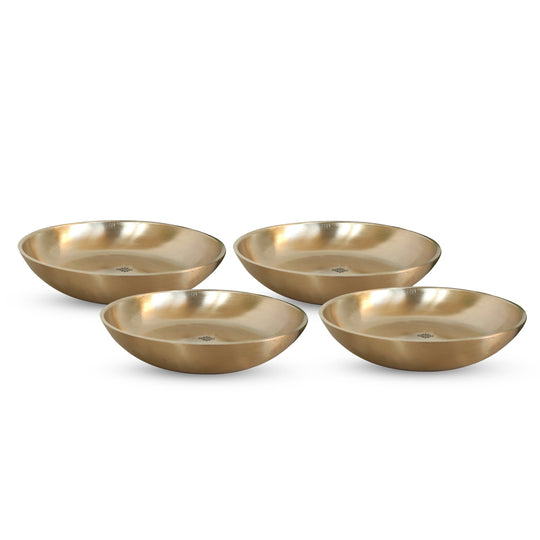 Indian Art Villa brass thali set with matt surface used as elegant tableware in restaurants with traditional themes

