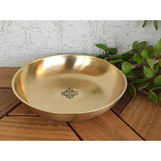 Indian Art Villa brass thali made in round form with soft matte finish and flat base bordered by smooth golden edge