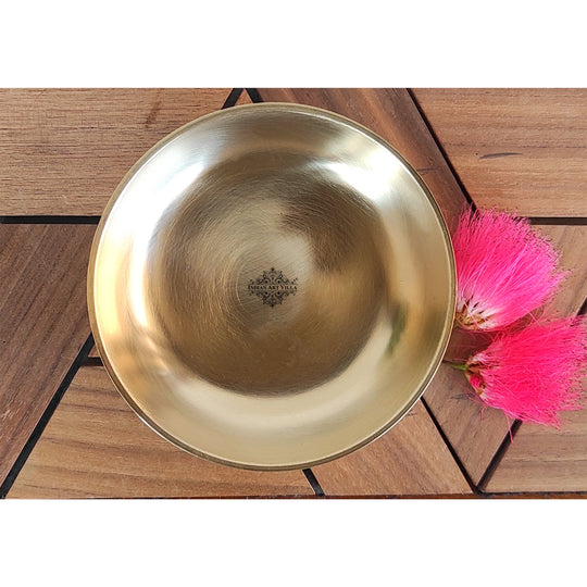 Handcrafted brass thali in classic round shape with satin matte finish and gently curved edges by Indian Art Villa