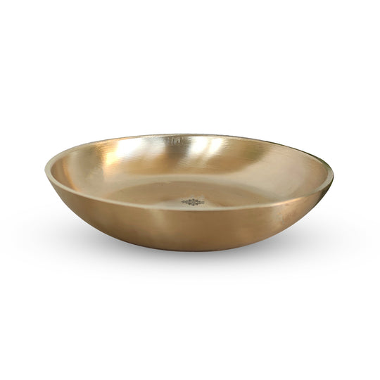 Matt finish brass thali in circular shape with golden tone and subtle handcrafted details by Indian Art Villa artisans