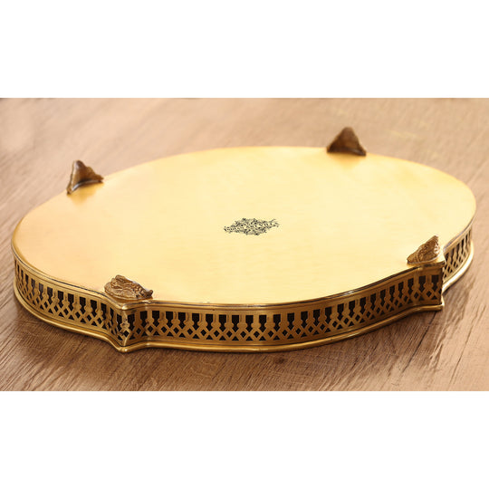 Handmade brass tray with floral engraved center and matt gold finish bordered by elegant oval frame by Indian Art Villa