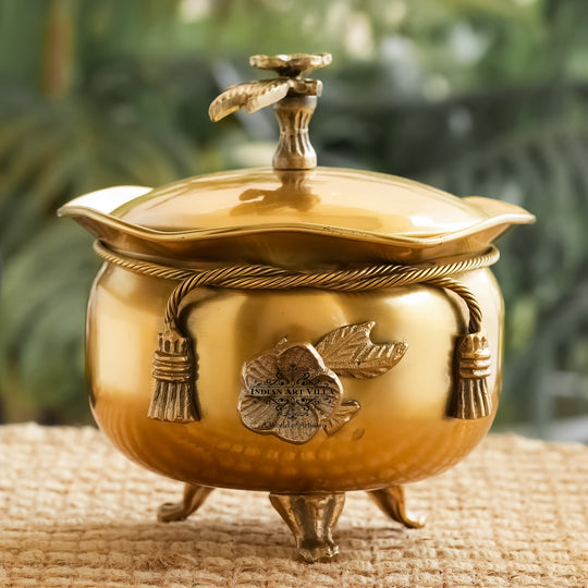 Indian Art Villa decorative brass handi with lid featuring bow neck detail embossed flower and sturdy three leg base