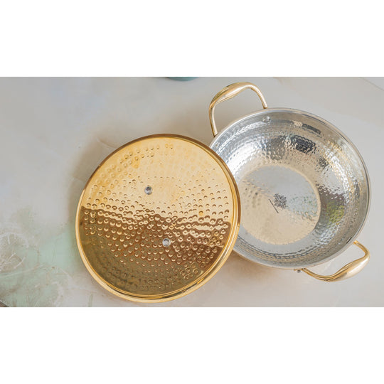 Elegant brass cooking utensils hammered design with tin lined interior flat lid and polished handles for refined serving