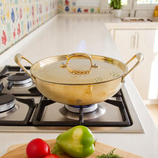 Authentic brass kadhai hammered golden body fitted lid protective tin lining inside designed for durable traditional cooking