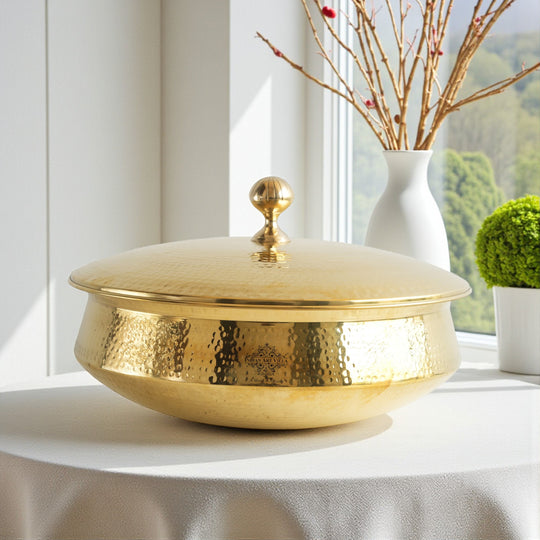 Traditional pital lagan cookware with wide base hammered surface tin coated inner body and matching brass lid on the top