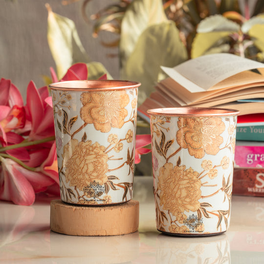 This pair of tamba glass for drinking water carries elegant gold flower artwork from Indian Art Villa