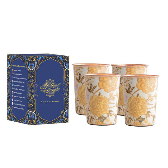 This set of 4 handcrafted copper glasses for drinking water from Indian Art Villa features intricate gold floral artwork.