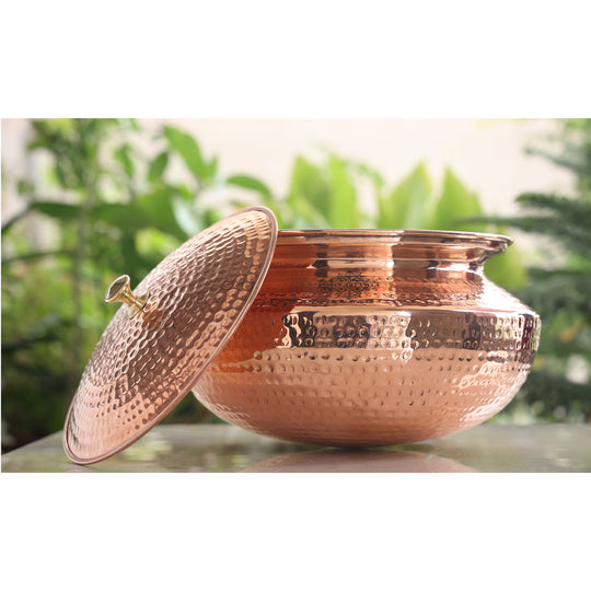 Pure copper handi with a hammered design and brass lid, ideal for adding a traditional touch to any kitchen.
