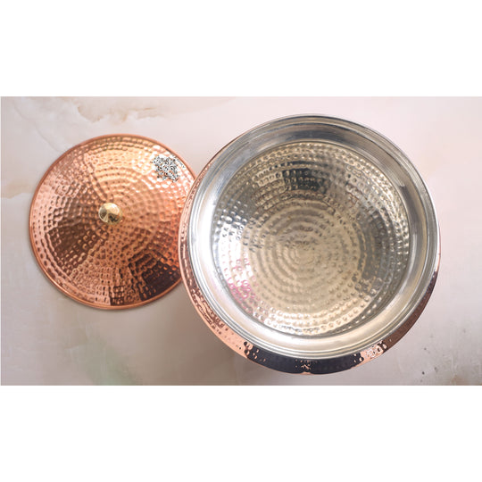 Traditional tamba handi with a finely crafted brass lid and a rustic copper finish, ideal for slow cooking