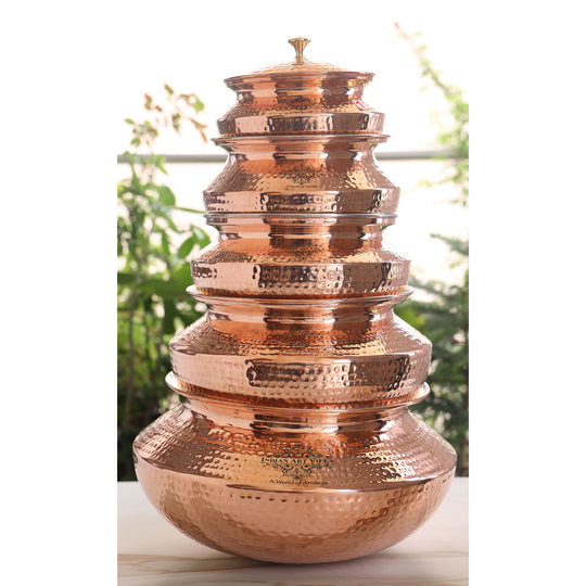 Richly crafted tamba handi with intricate copper detailing and a polished brass lid, perfect for slow-cooking