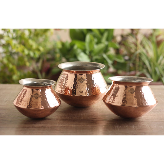 High-quality copper handi set with tin lining ideal for preparing festive meals such as biryanis and hearty stews.