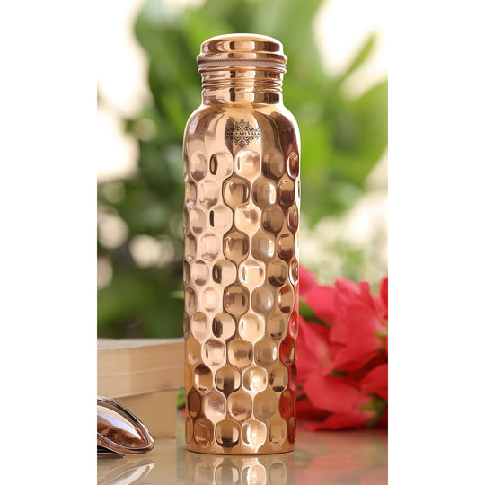 Indian Art Villa tamba bottle, lacquer coated, with a sculpted diamond design to blend heritage with modern hydration.