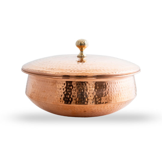 Handcrafted copper handi for cooking from Indian Art Villa offers excellent heat distribution and traditional design.

