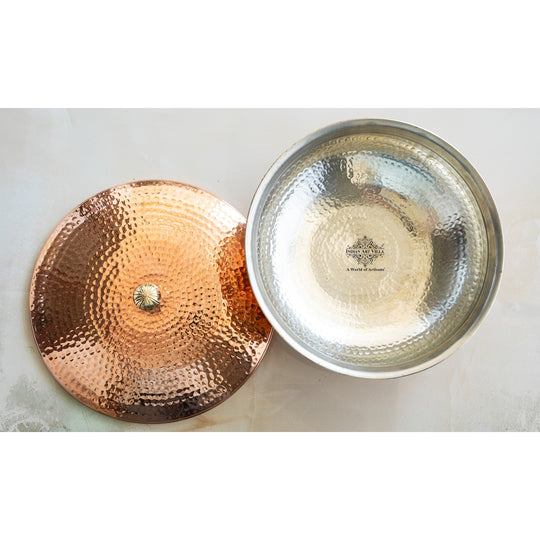 Made by Indian Art Villa this copper handi with inside tin lining and rounded shape is ideal for dum cooking