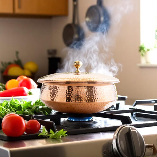This copper handi by Indian Art Villa works as an antique style serving bowl or authentic Indian cooking vessel