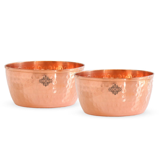 Decorative hammered copper katori with a shiny surface and intricate texture perfect for home decor.