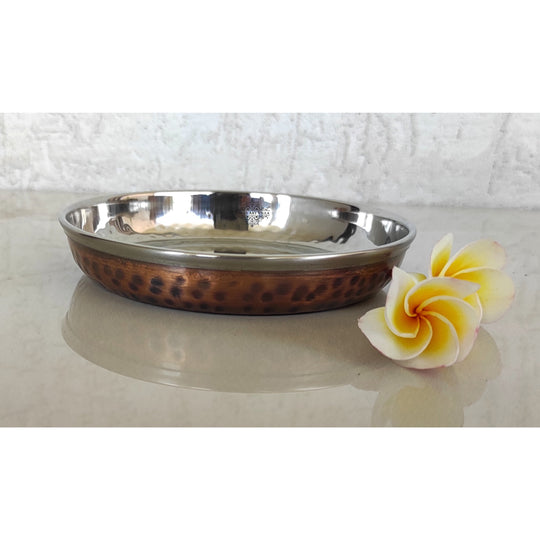 Distinctive hammered copper steel platter perfect for serving food during special celebrations or dinner parties.
