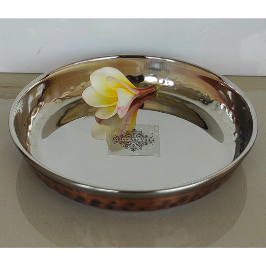 High-quality steel copper plate with an intricate hammered finish ideal for serving dinner courses at celebrations