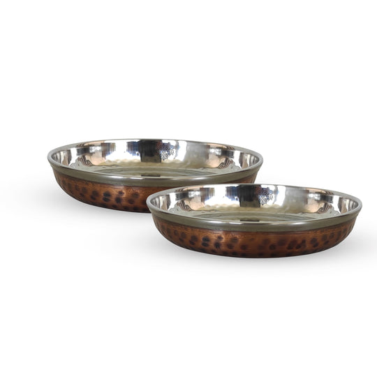 Decorative steel copper plate with hammered finish perfect for serving rice halwa and desserts at social events.