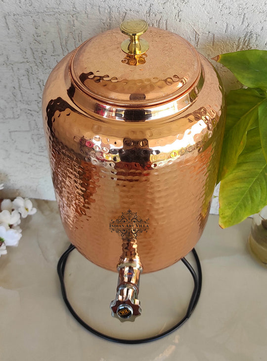 Front angle of 5 ltr copper pot on stand showing four-leg iron base and matka seated in ring cradle – copper water pot with stand
