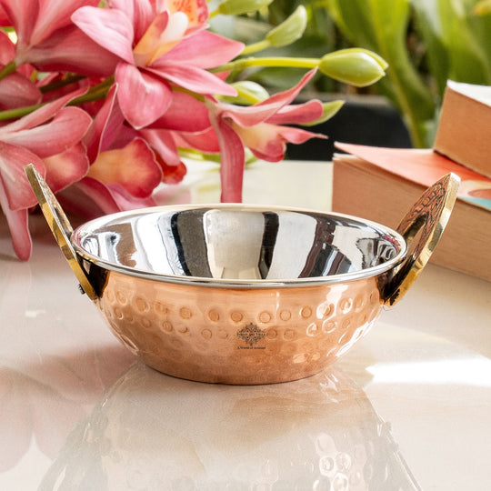 Indian Art Villa Steel Copper Hammered Kadhai serveware with brass handles.