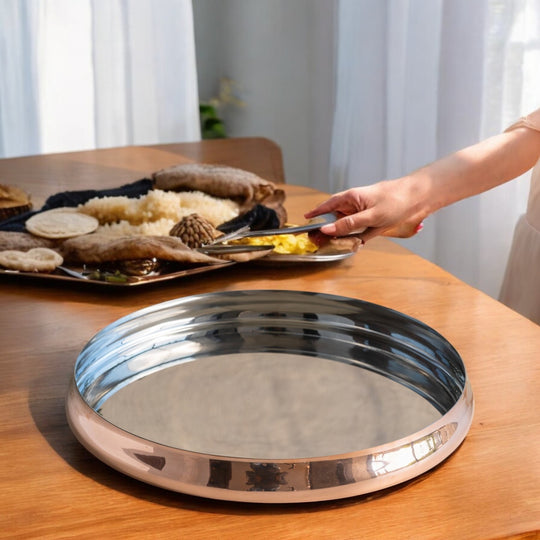 Indian art villa's tamba plate designed for presenting food in hotels during fine dining events.