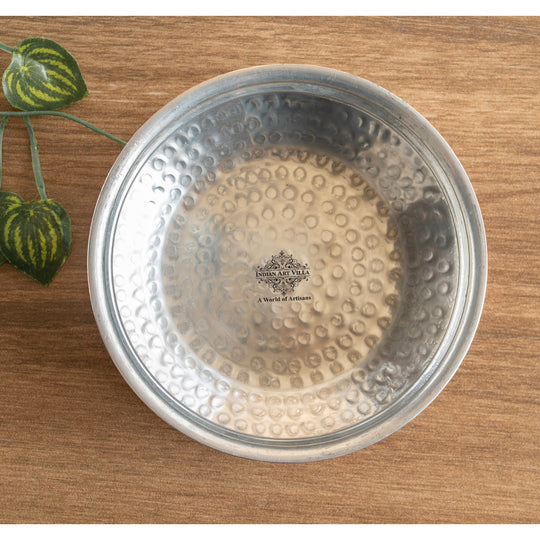 Hand-forged copper pot with a sophisticated hammered design, perfect for both preparing meals and showcasing them.