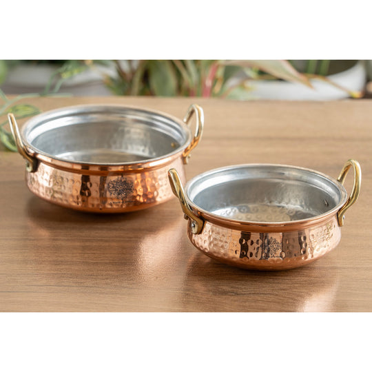 Elegant copper pot with hammered exterior and tin lining, ideal for foodies and those hosting special occasions.