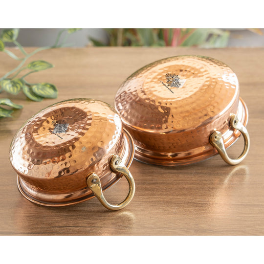 Beautiful hammered copper handi with handle and tin lining, ideal for serving traditional meals.