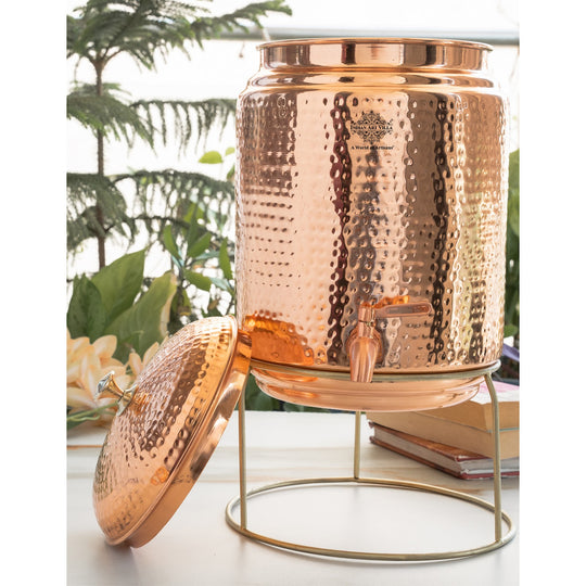 5 litre round copper matka on wooden platform for traditional home water storage – tamba matka