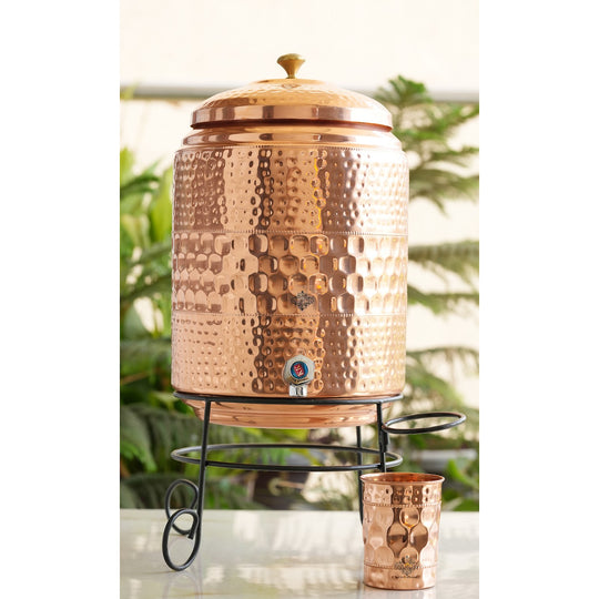 Side angle of 5L hammered copper pot elevated on iron stand legs – copper water pot with stand