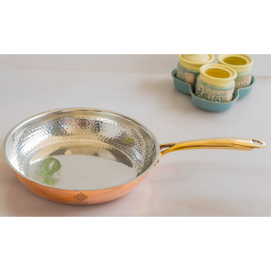 Elegant copper frying pan by Indian Art Villa with a hammered design and handle for the perfect cook.