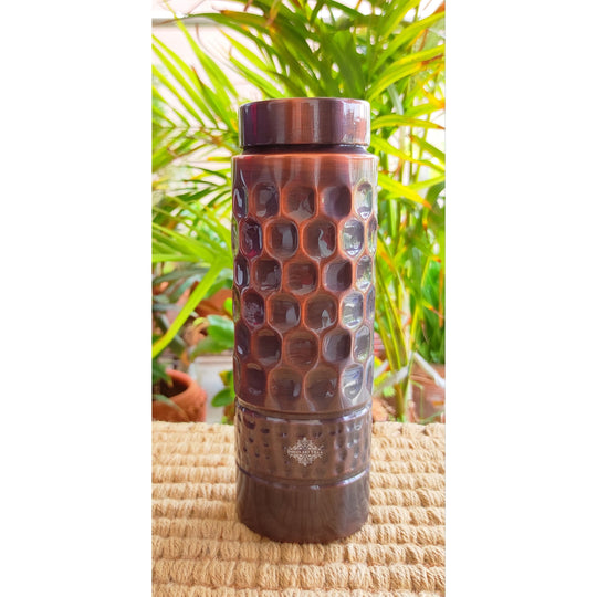 Rich dark polished copper bottle with honeycomb embossing and straight silhouette by Indian Art Villa