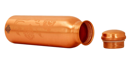 Pure copper water bottle and glass set with floral engraving and leak-proof cap, ideal for health and hydration.