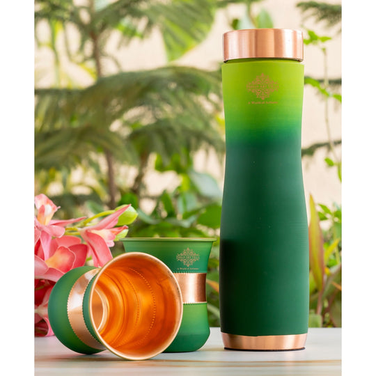 Green silk finish copper bottle with matching glasses by Indian Art Villa, designed for stylish home displays.