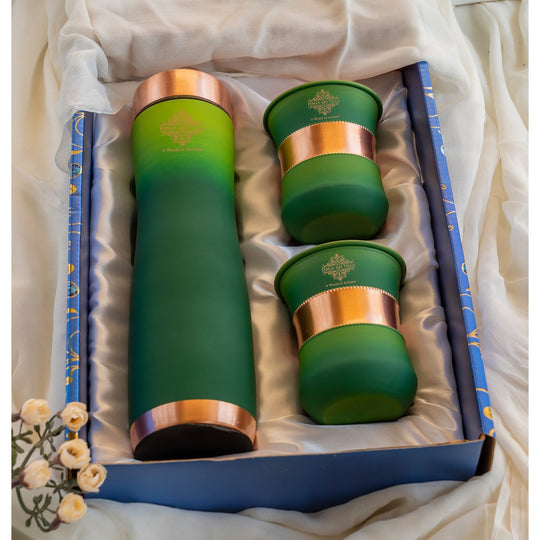 Green silk finish copper bottle with matching glasses by Indian Art Villa, designed for stylish home displays.